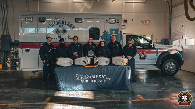 Picture of staff standing in front of the Lucas Devices recently donated 