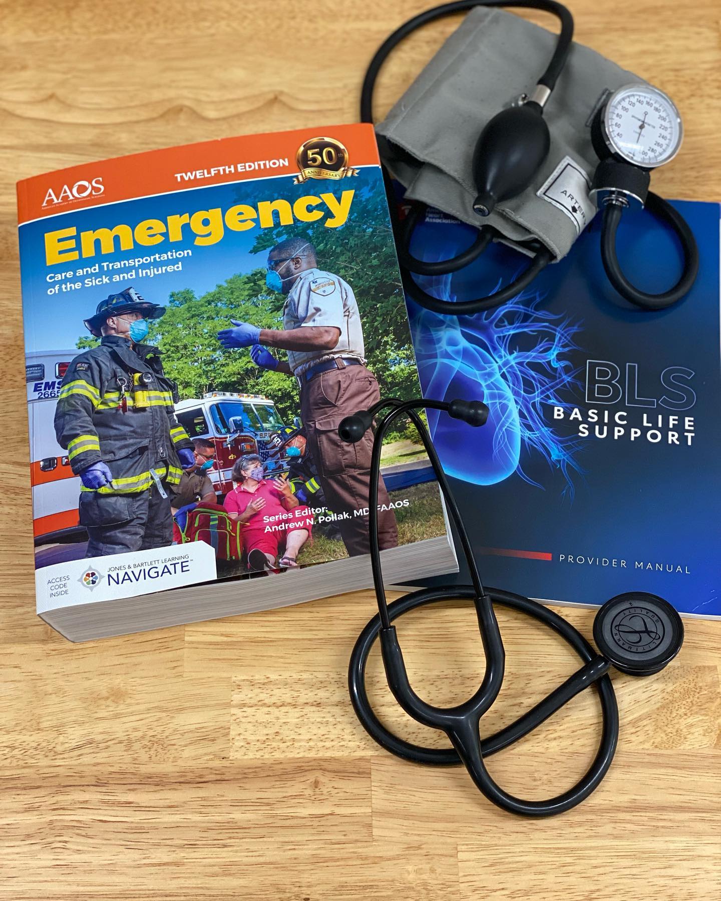 Picture of EMT textbook and Blood pressure cuff 